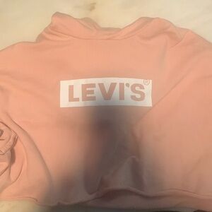 I am selling a cute peach colored hooded crop top